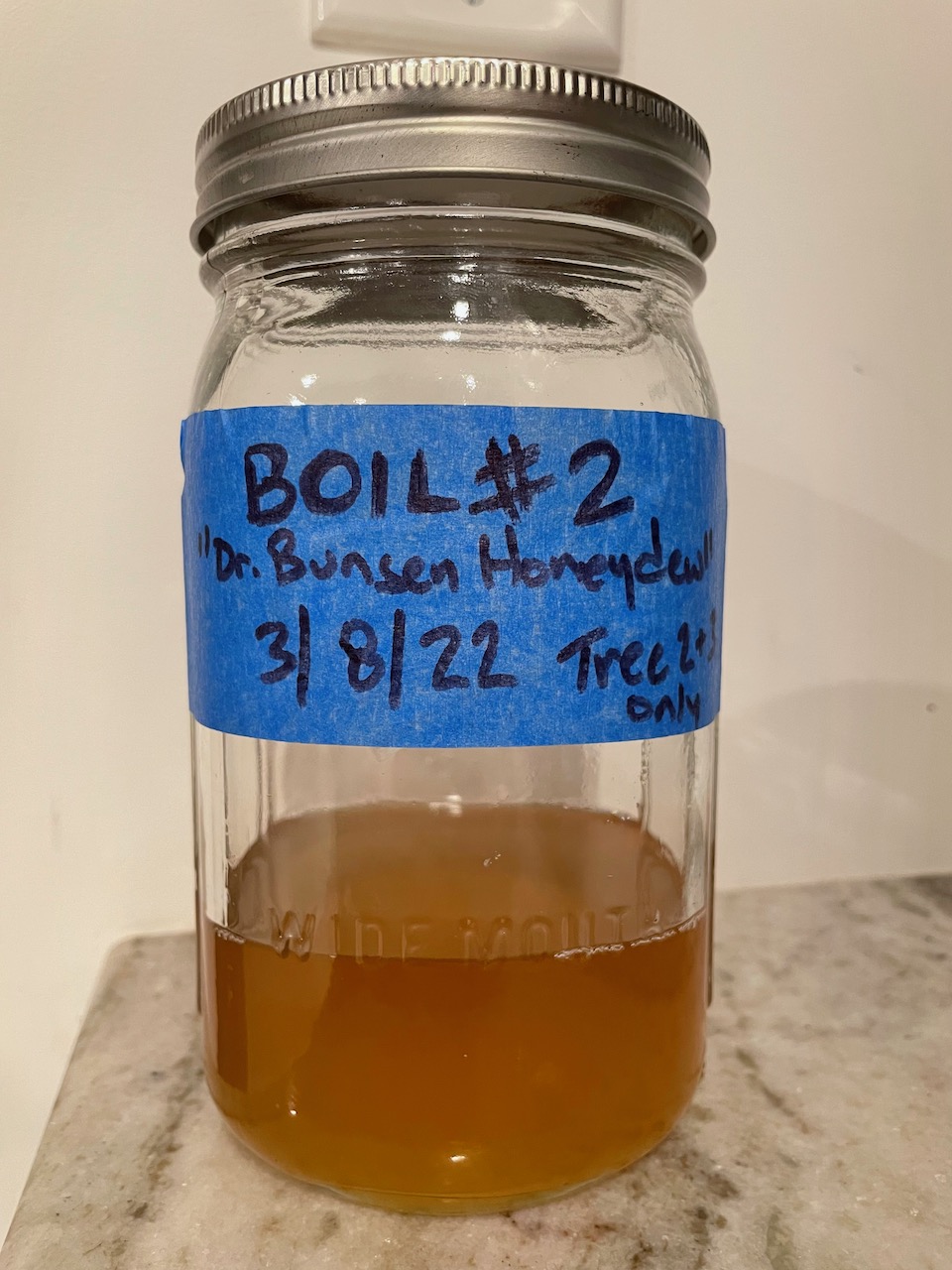 A jar of sap, labeled Boil #2 Dr Bunsen Honeydew 3/8/22